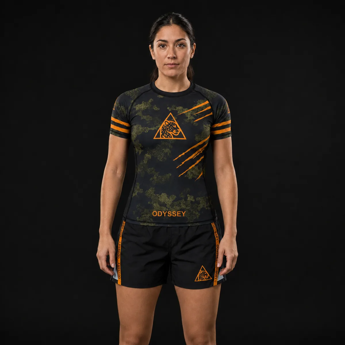 Short de grappling Odyssey negro con cinta naranja, vista frontal